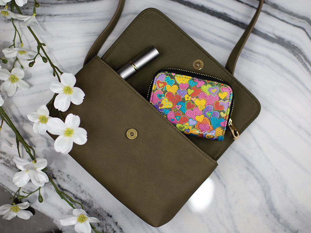 Laurel Burch Dancing Hearts RFID zipper wallet in a purse